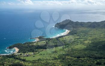 Aerial view of Kawelikoa Point and landscape of hawaiian island of Kauai from helicopter flight