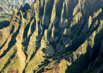 Aerial view of Na Pali mountains and landscape of hawaiian island of Kauai from helicopter flight