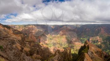 Colorful red rocks in the grand Waimea Canyon on the hawaiian island of Kauai