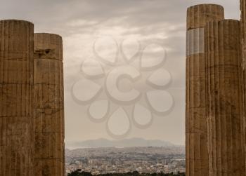 Columns on Acropolis frame the city of Athens surrounding it