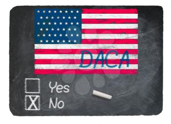 DACA No Vote message written in chalk on a chalky natural slate blackboard for current debate over Dreamers