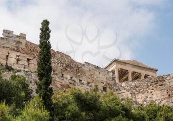 Walls of Acropolis rise above Anafiotika in Athens by the Acropolis