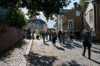PORVOO, FINLAND - SEPTEMBER 11: Tourists walk through streets on September 11, 2017 in Porvoo, Finland. Porvoo is one of the six medieval towns in Finland