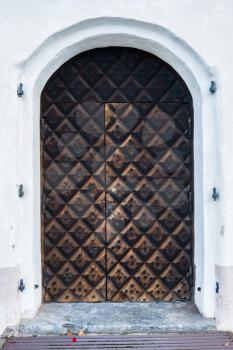 Carved wooden entrance to cathedral church in ancient town of Porvoo in Finland