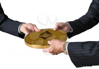 Hands of three financial traders gripping ethereum coin isolated against a white background