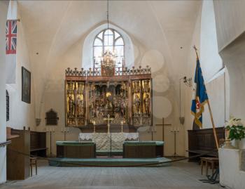 TALLINN, ESTONIA - SEPTEMBER 14: Carved altar in Holy Spirit Church on September 14, 2017 in Tallinn, Estonia. The altar dates from 1483