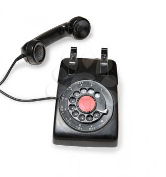 Old and antique rotary telephone isolated against white background