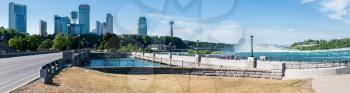 NIAGARA FALLS, CANADA - JUNE 30, 2016: Panorama of the Canadian side of Niagara Falls with hotels casino and river taken from power station