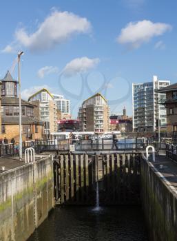 LONDON, UK - JANUARY 30, 2016: Entrance lock gates into canal leading to Limehouse Basin Marina in Docklands, London, England