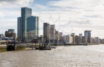 LONDON, UK - JANUARY 30, 2016: Skyline of the main office buildings on a cloudy day in Canary Wharf, Docklands, London, England