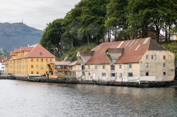 Old and dilapidated wooden storage or warehouses on waterfront of Bergen Norway