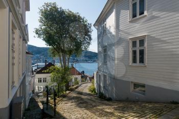 Narrow cobbestone Verfstbakken street in the old town of Bergen in Norway