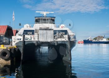 Express catamaran passenger ferry docked in Bergen harbor