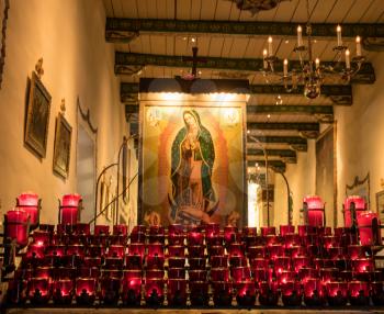 SAN JUAN CAPISTRANO, CALIFORNIA - 1 NOVEMBER 2017: Prayer candles and church interior at San Juan Capistrano in California