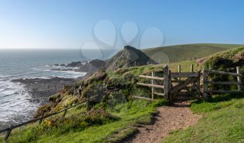 Gate over headlands on south west coastal path near Hartland Quay in North Devon, England