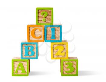 ABC and 123 Number wooden blocks stacked on white background with question mark