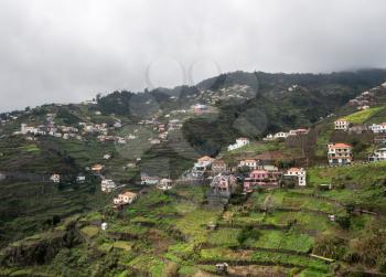 Houses and terraced fields for farming on the mountainside above Funchal in Madiera