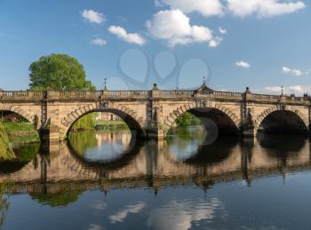 View of river Severn and English Bridge in Shrewsbury Shropshire with retirement apartments in background