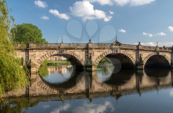 View of river Severn and English Bridge in Shrewsbury Shropshire with retirement apartments in background