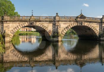 View of river Severn and English Bridge in Shrewsbury Shropshire with Eight rowing boat in background