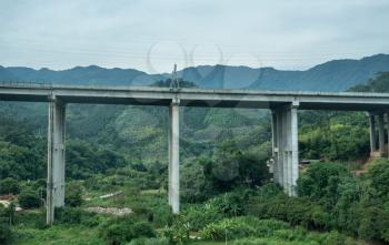 Modern concrete motorway or main road bridge in rural mountains