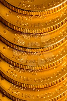 Stack of golden coins using US Treasury issue Gold Eagle one ounce pure gold coin