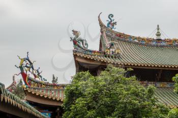 XIAMEN, CHINA - OCTOBER 31, 2018: Detail of roof carvings on South Putuo or Nanputuo Temple