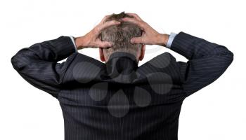 Back view of senior caucasian man worried and afraid and holding his head in his hands