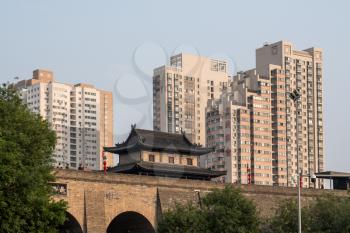 Apartments and homes by the side of the city wall in Xian, China on smoggy day