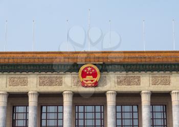Flag and crest of Chinese Replublic on Great Hall of the People in Tiananmen Square