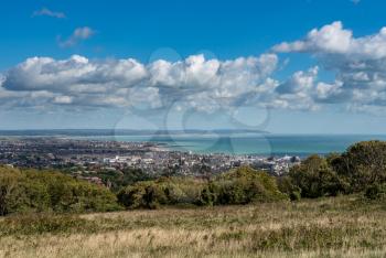 Panoramic overview of the seaside town of Eastbourne from the downs leading to Beachy Head