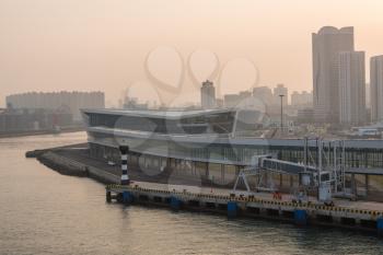 Ship approaching International Cruise ship port in mist at Qingdao in China