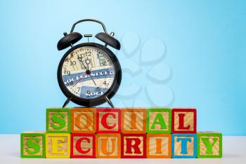 Time running out concept for Social Security trust fund with alarm clock approaching midnight