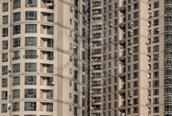 Many chinese apartments have washing hanging outside on balcony in large block of flats