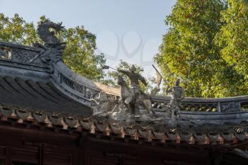 Detail of George and Dragon on roof in Yu or Yuyuan Garden in  the old city of Shanghai