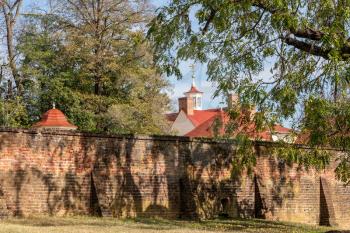 Red tiled roof of Mt Vernon home of George Washington behind the brick walled garden