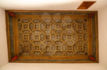 Ornate carved wooden ceiling inside the Casa de la Conchas or shells around the central courtyard in Salamanca