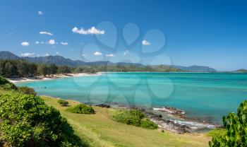 Panorama of the wide sandy Kailua Beach with mountains in background on east coast of Oahu in Hawaii