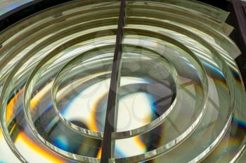 Close image of the glass prisms making up a fresnel lens in a lighthouse