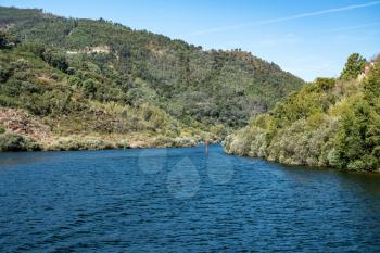 Depth markers in the narrow section of Douro river in Portugal just below the Carrapatelo dam and lock