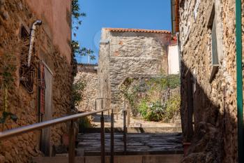 Old stone houses and narrow street in the ancient town of Castelo Rodrigo in Portugal