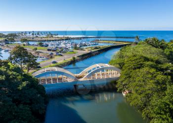 Aerial shot of the river anahulu and the twin arched road bridge in the North Shore town of Haleiwa