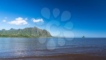 Chinaman's hat off the coastline of Oahu in Hawaii from the Waiahole Beach Park