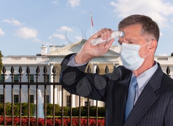 Mockup of senior adult wearing mask checking for coronavirus fever with thermometer before going into White House for meeting