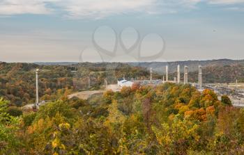 Overview of natural gas fracking pad near Moundsville West Virginia in the fall with autumn trees