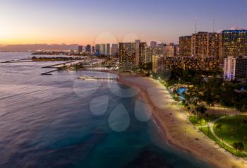 Aerial panorama of Waikiki beach and Honolulu on Oahu, Hawaii at sunset