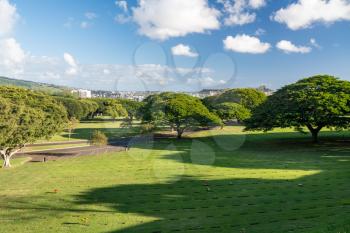 Open grass in the National Memorial Cemetery of the Pacific in punchbowl crater on Oahu, Hawaii