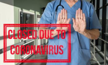 Doctor in scrubs refusing entry to patient to hospital due to no coronavirus ventilator critical care beds available