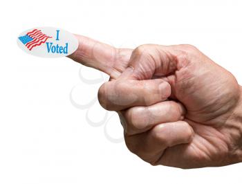 Senior mans hand with I voted sticker on finger as he makes a fist to show a firm voter in presidential election