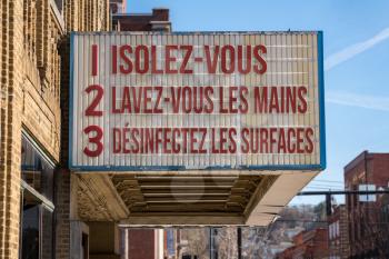 French movie cinema billboard with three rules to avoid the coronavirus epidemic. Translation, wash hands, maintain social distance and clean surfaces